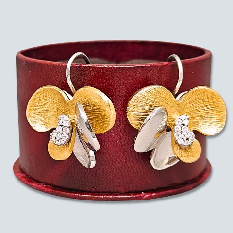 Ole Lynggaard; Earrings of 18k gold ang white gold set with diamonds Ole Lynggaard; Earrings of 18k gold ang white gold set with diamonds